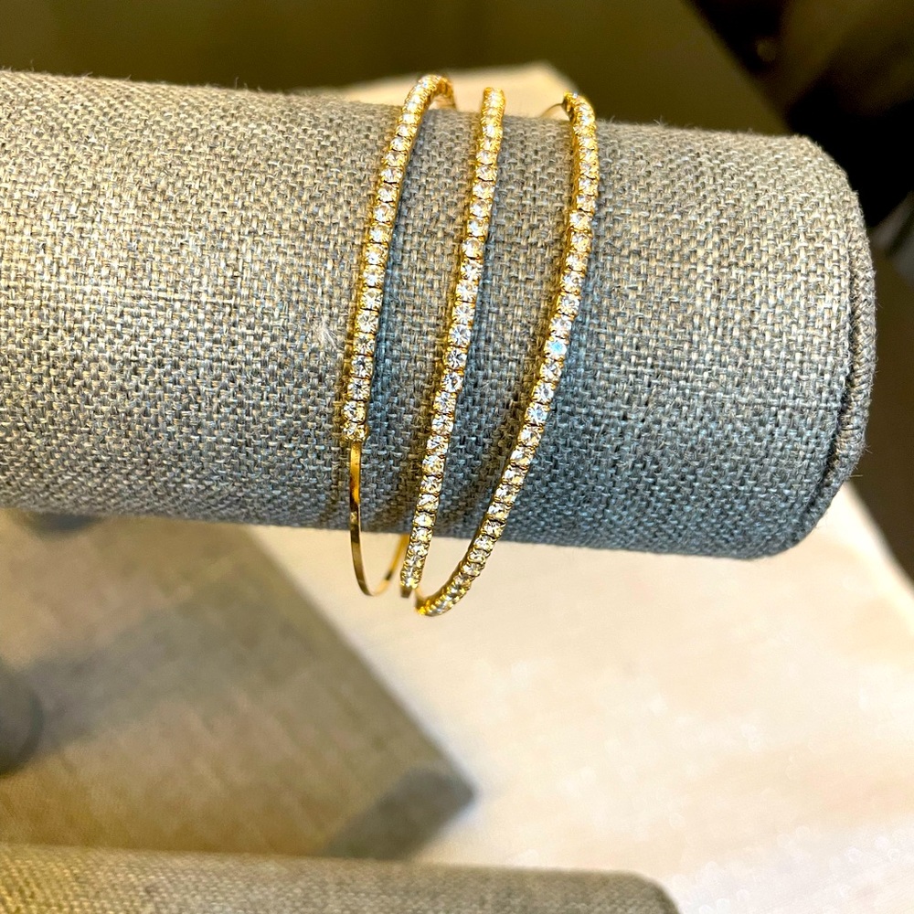 Gold tone cubic zirconia bangle bracelet